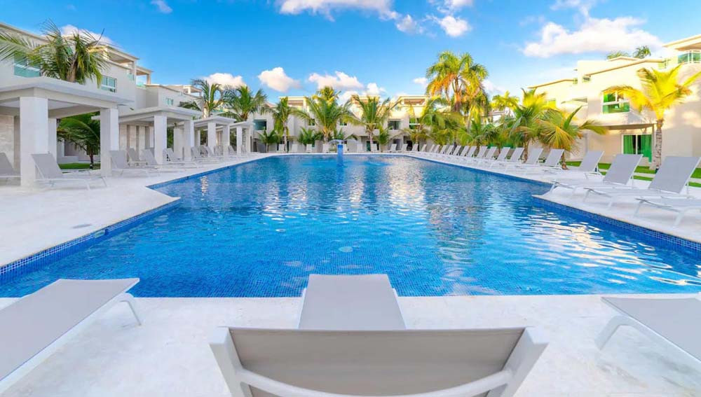 A wide view of the pool at Beach Apartamentos at Playa Palmera